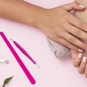 hands-with-manicure-done-and-nail-care-tools1